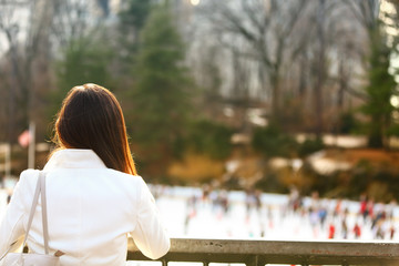 Central park skating rink - woman in New York City