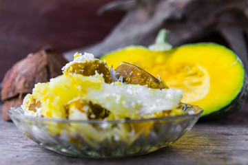 Still life with pumpkin and yam candy, sprinkle ,grated coconut.