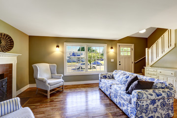 Living room with fireplace and antique chairs