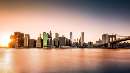 Lower Manhattan skyline at sunset - obrazy, fototapety, plakaty