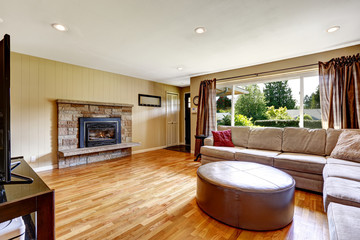 Living room with stone trim fireplace and comfortable sofa