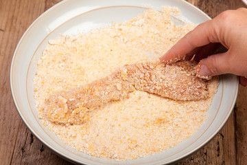 rolled chicken in to breadcrumbs