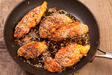 chicken breast with breadcrumbs and sezame seeds