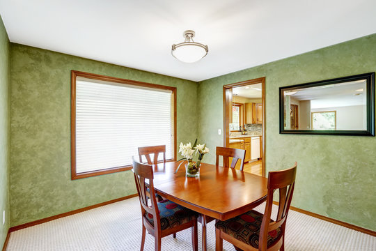 Dining room with bright green walls