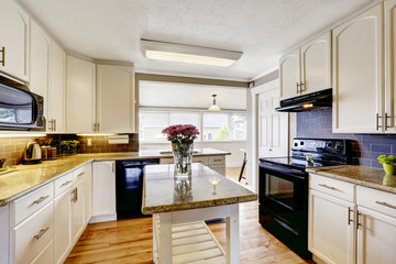 Kitchen room with island and granite tops