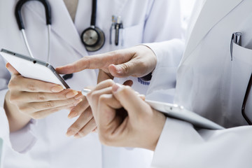 Hand of female doctor with a mobile terminal
