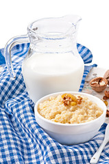 Porridge in a bowl with nuts and raisins