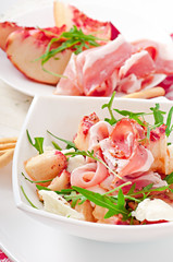 Salad with peach, mozzarella cheese and ham