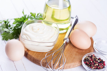 Mayonnaise in bowl on table