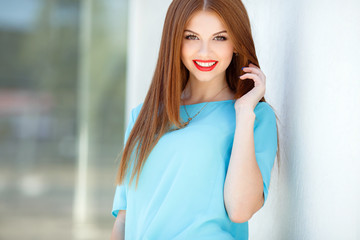 Young smiling woman outdoors portrait.
