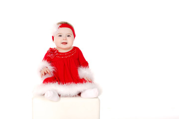 little girl in Santa costume.