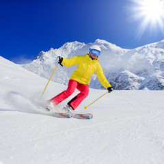 Fototapeta na wymiar Skiing, skier, winter sport - woman skiing downhill