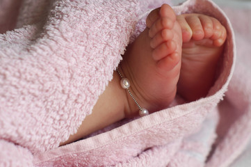 Close-up of  Baby feet under blanket