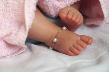 Close-up of  Baby feet under blanket