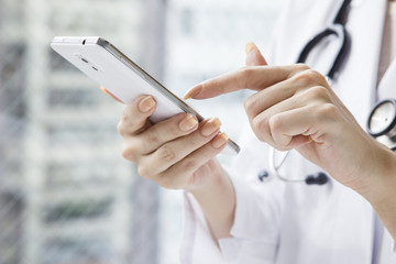 Hand of female doctor that using mobile phones