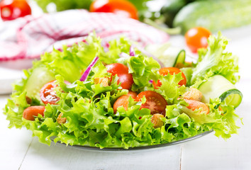 plate of fresh salad with vegetables