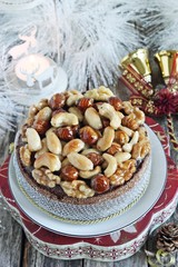 Christmas cake with caramelized nuts,chocolate and spices.