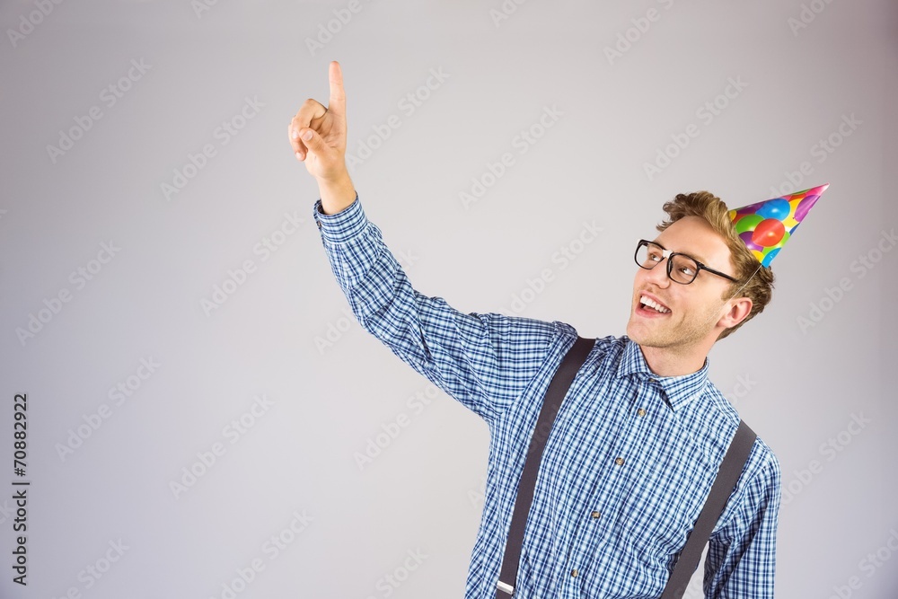 Poster geeky hipster wearing party hat pointing