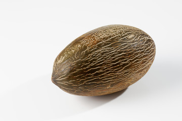Krötenhautmelone auf weissem Untergrund