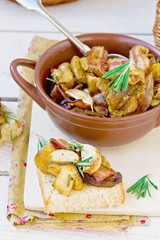 Fried cepes with bacon, garlic and rosemary
