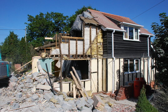 Demolition of the side of a house.