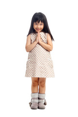 Asian child greeting with sawasdee