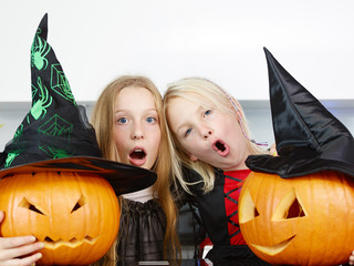 Young girls with pumpkins
