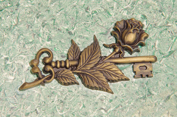 key symbol on marble stone