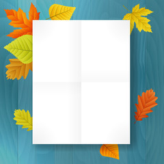 autumn blank paper on blue wood background