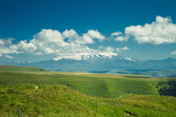 Fototapeta premium summer mountains green grass and blue sky landscape
