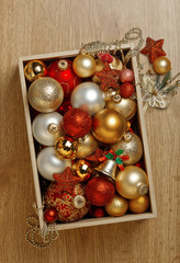 Christmas decoration in box on wood board