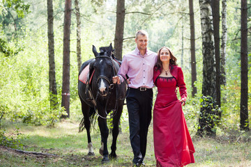 happy couple and horse