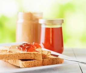 Toasts with peanut butter and strawberry jam
