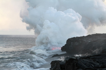 Fototapeta na wymiar Glowing Lava and Steam in Ocean