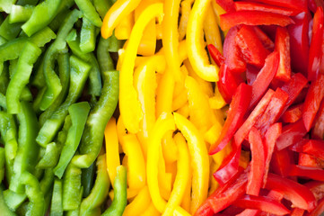 sliced colourful paprika peppers background