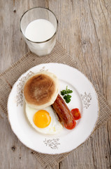 sausage and fried egg on a plate