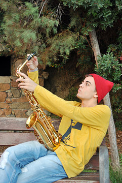 modern musician posing with his saxophone