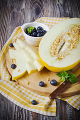 melon on a wooden cutting board