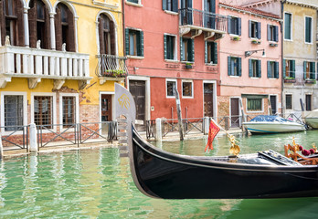 Obraz na płótnie Canvas Gondola moored on a venetian canal - Venice, Italy Europe
