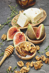 Cheese and fresh figs with honey and nuts