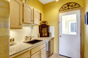 Small kitchen area with moden cabinets