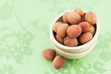 Close-up of fresh lychee fruit in the wooden
