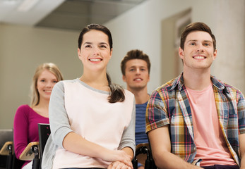 group of smiling students in lecture hall