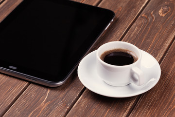 Fototapeta na wymiar empty tablet pc and a coffee