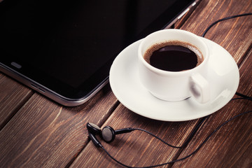 empty tablet pc and a coffee