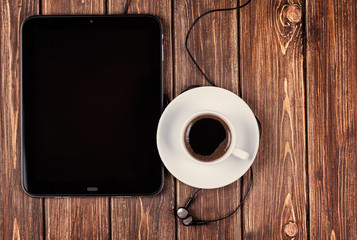 empty tablet pc and a coffee