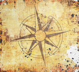 Fototapeta na wymiar Old compass on paper background