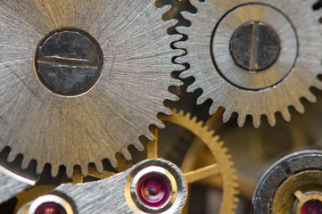 Metallic Background with metal cogwheels a clockwork. Macro