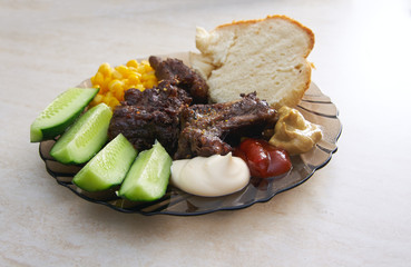 Plate with a variety of food on the table