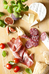 Chopping board of Assorted Cured Meats and Cheese